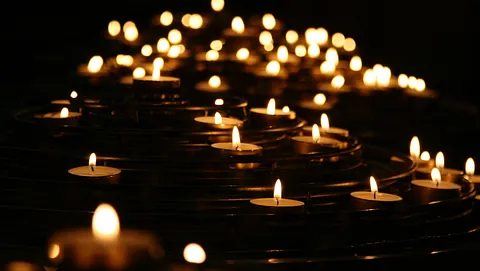 lots of lit tealights, some in focus and some out of focus